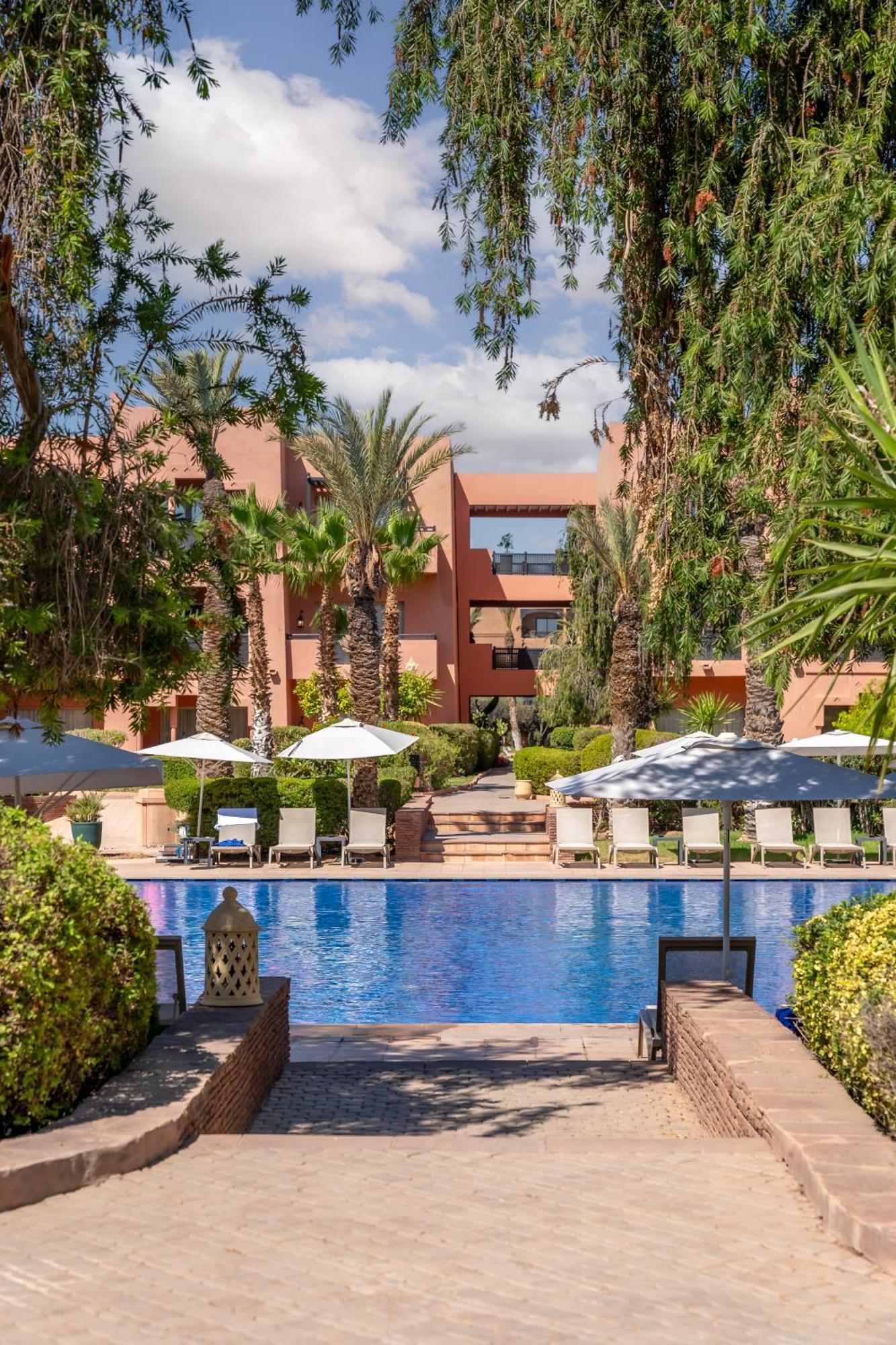 Kenzi Menara Palace & Resort Маракеш Екстериор снимка The swimming pool at the hotel